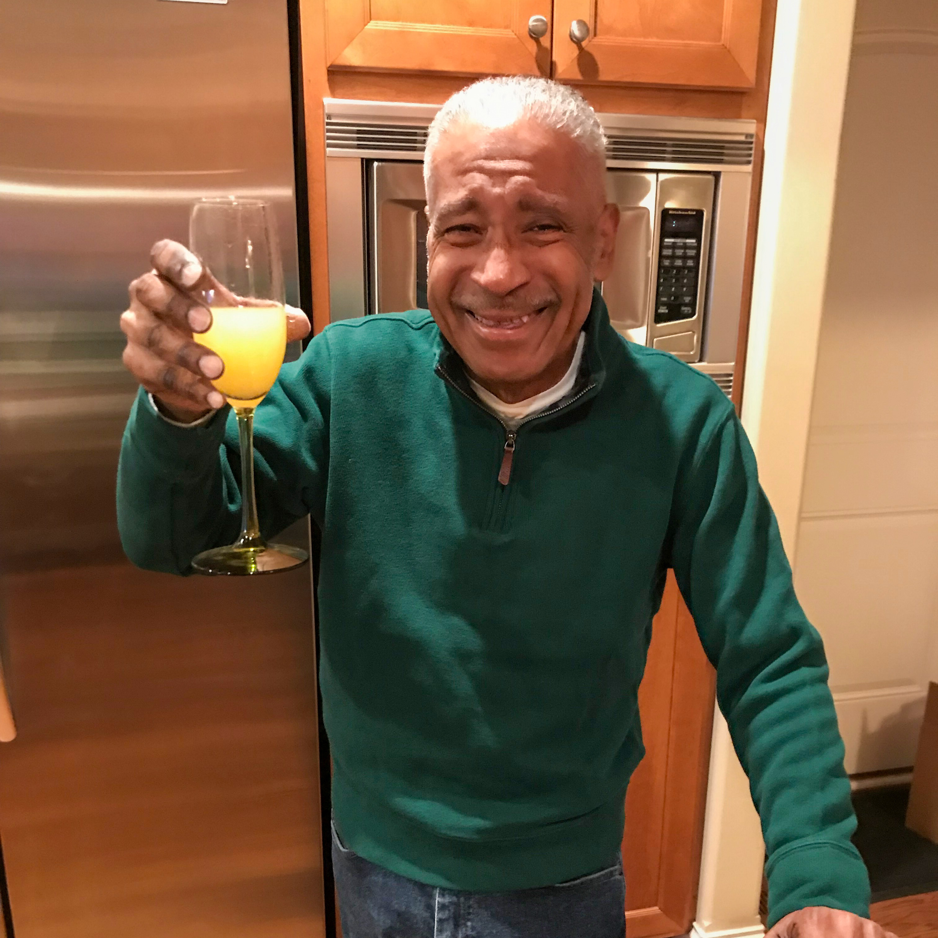 Uncle Edwy smiling at family gathering